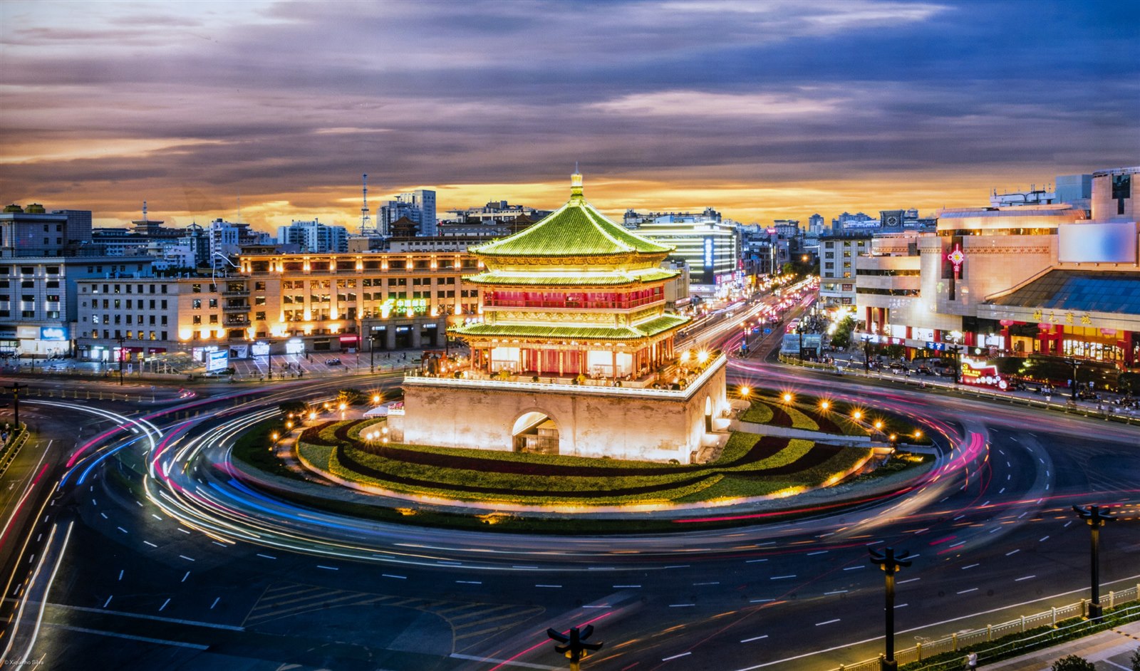 Xi’an Bell Tower illuminated against the evening sky